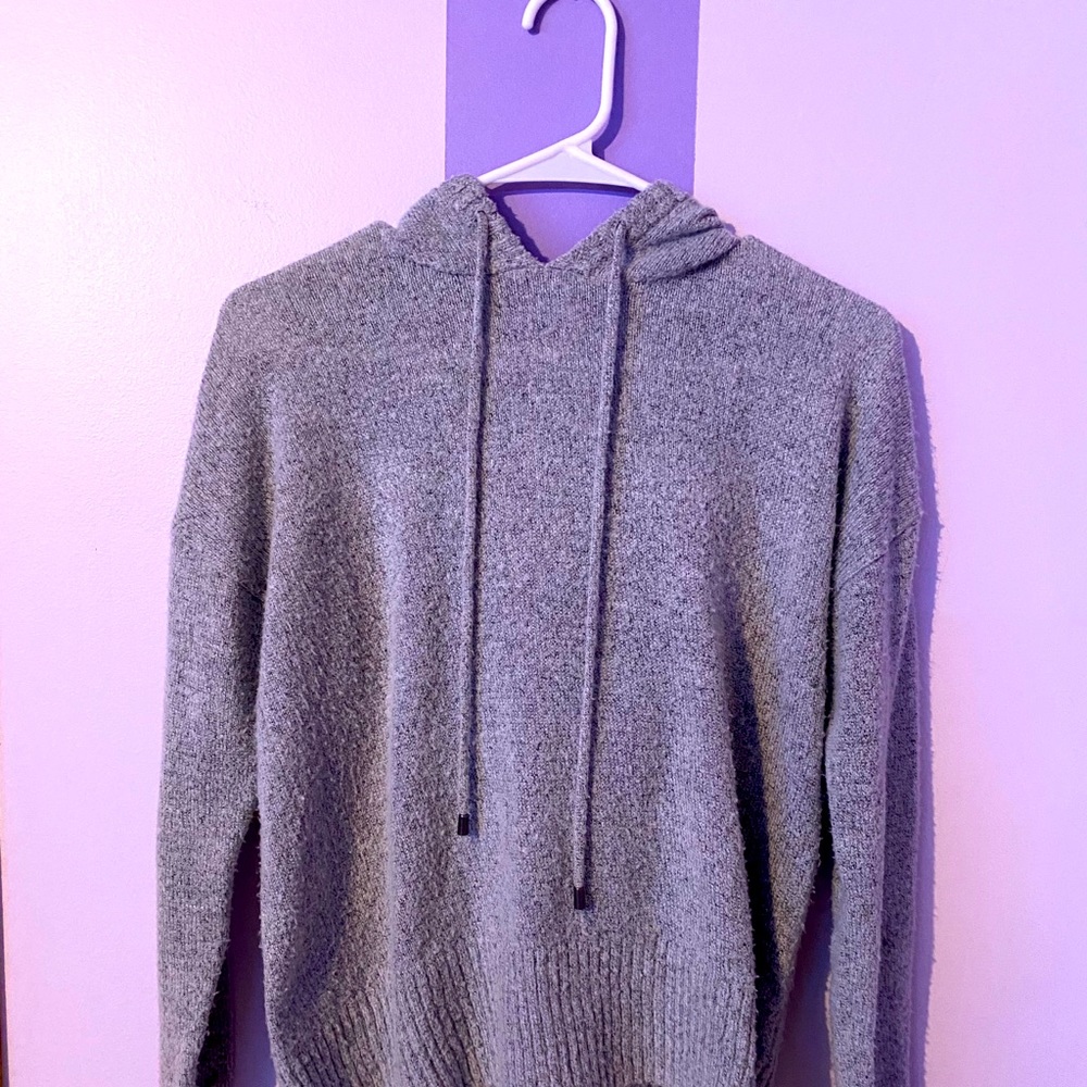 Grey sweater with hood.